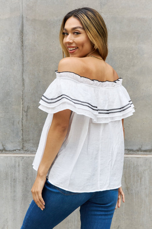 Ruffle Off-the-Shoulder Blouse with Contrasting Embroidery Detail